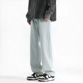 Men's light blue washed straight leg jeans with button waist on mannequin showing front view