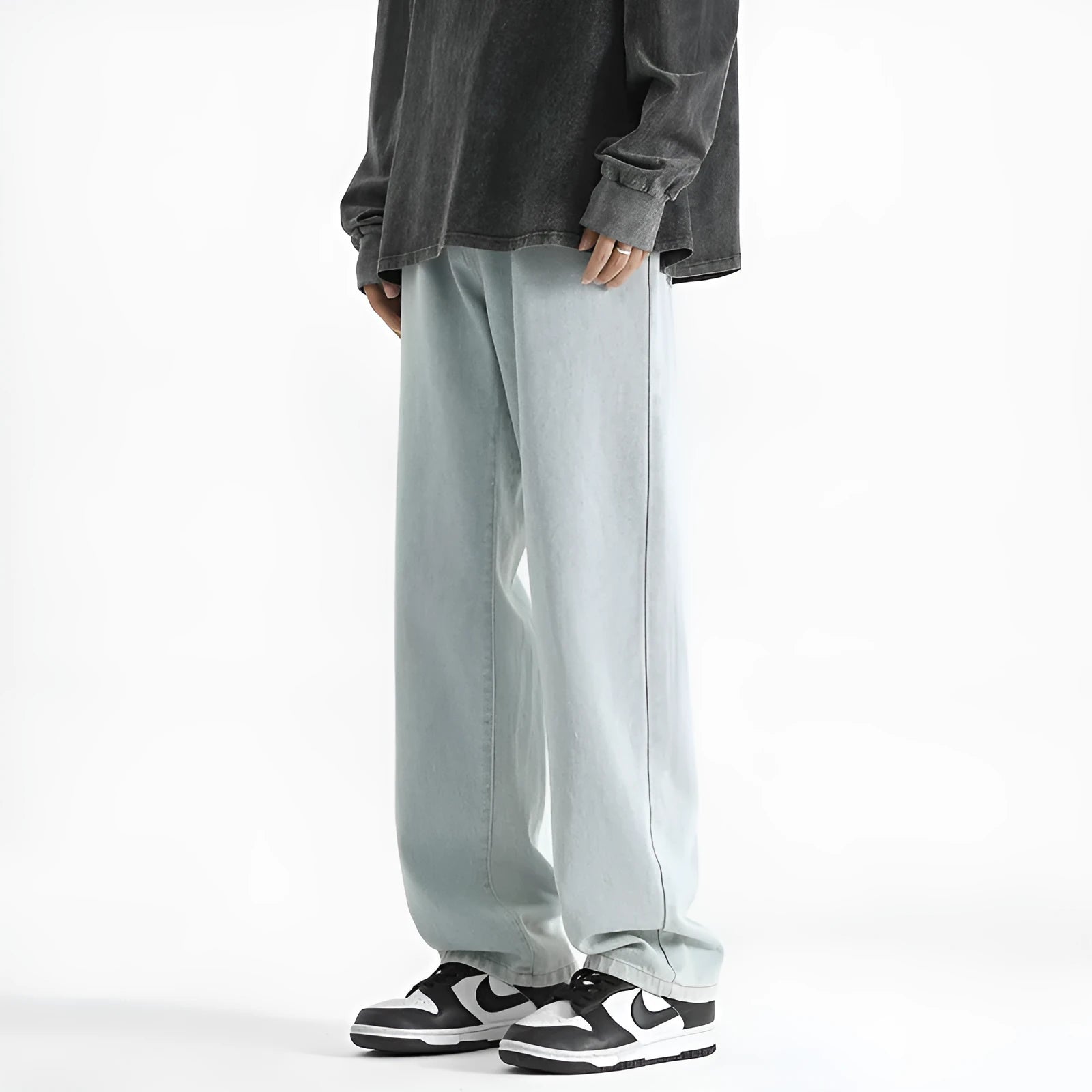 Men's light blue washed straight leg jeans with button waist on mannequin showing front view