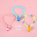 Adjustable plastic pet collar in macaron candy colours on a white background.