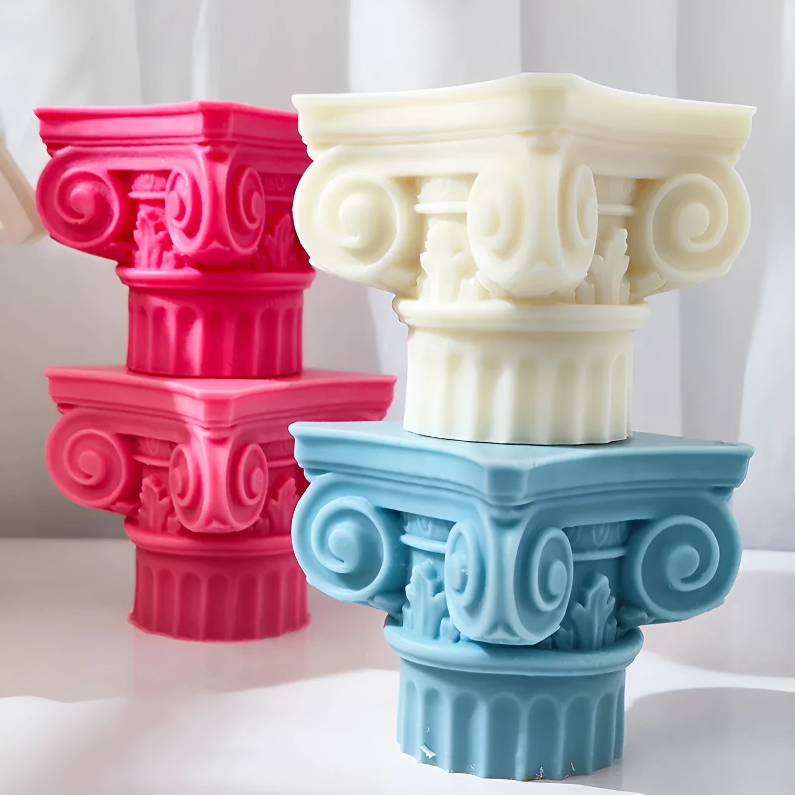 A flexible silicone mould in the shape of an irregular Roman pillar for making candles, chocolate, and crafts.
