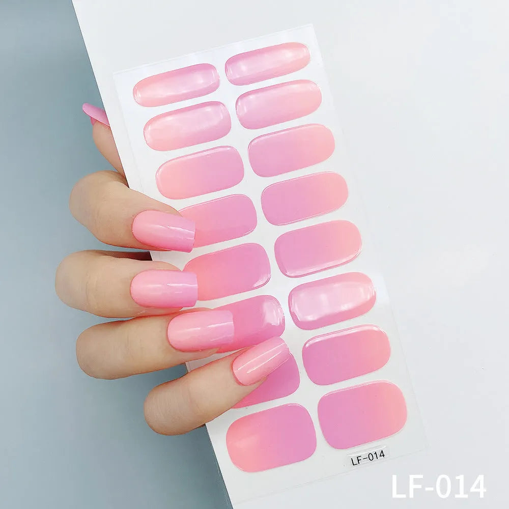 Full coverage nail art stickers sheet with 16 designs including cross, rose, tulip, and cartoon patterns.