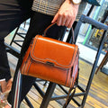 Women's genuine leather messenger bag in retro styling with multiple internal compartments