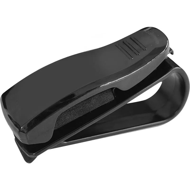 Black plastic car sunshade clip for holding glasses, tickets and ID cards, dimensions 6.5 by 2.3 centimetres