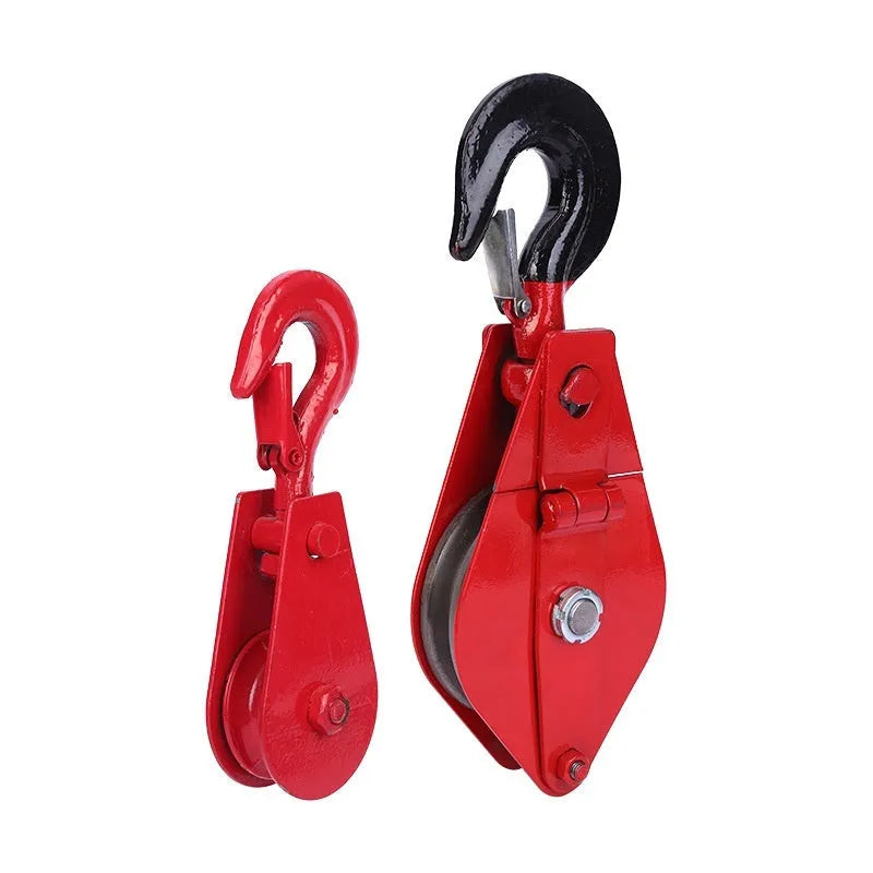 Red industrial lifting pulley with steel hook and safety latch for factory harbour construction applications