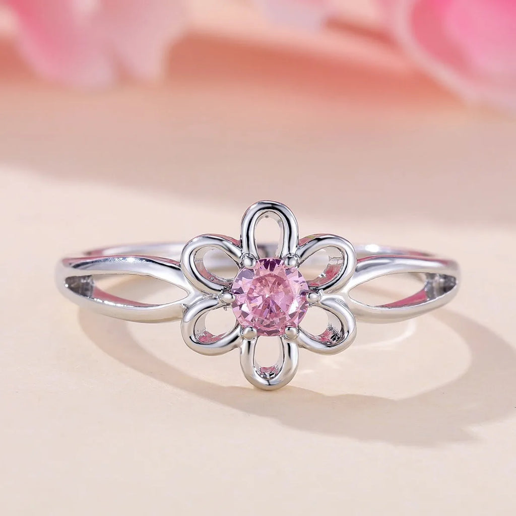 Women's floral hollowed fashion ring in electroplated finish showing flower design detail
