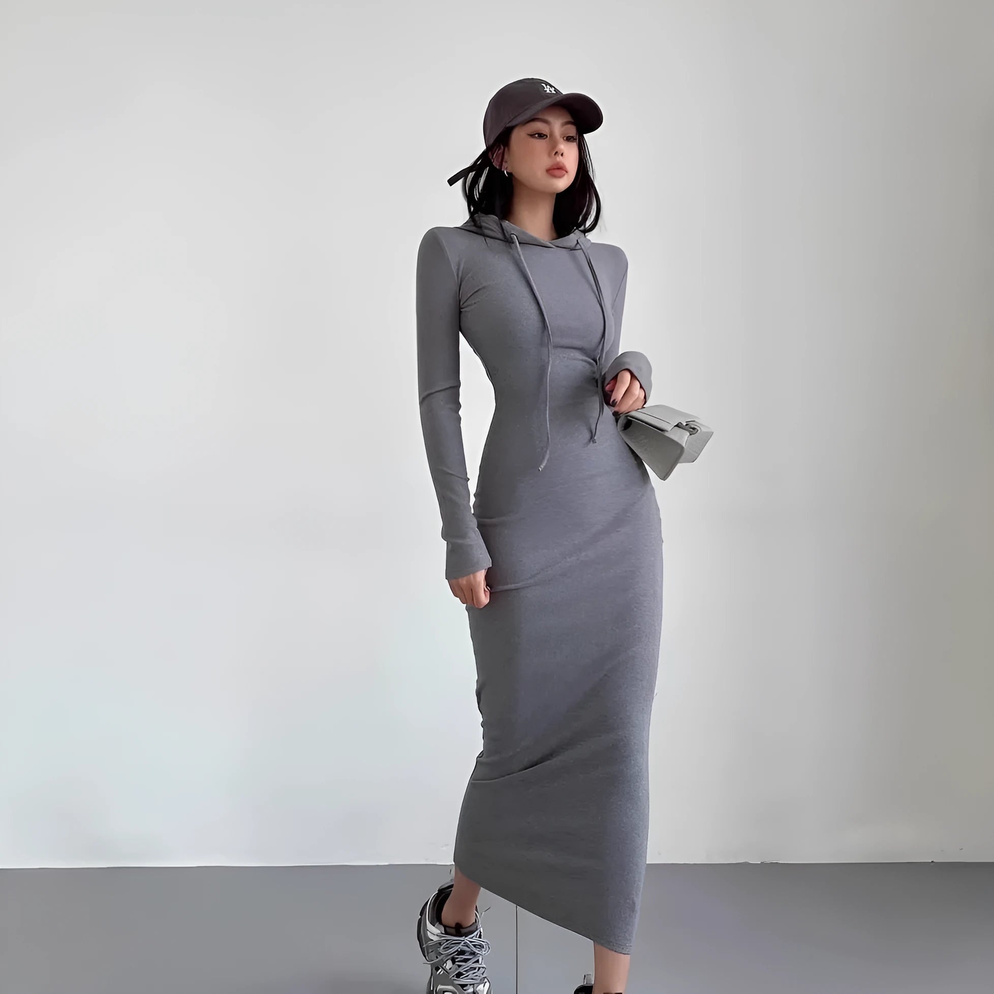 Women's grey hooded long sleeve sheath dress with a high waist and knee-length skirt.