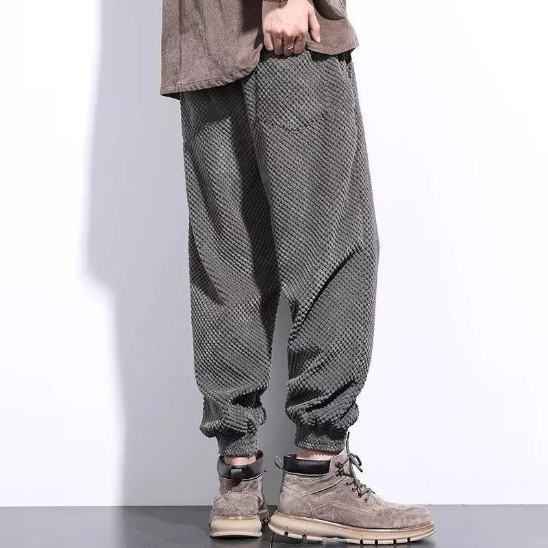 Men's grey casual sweatpants with an ankle tie and straight-leg fit.