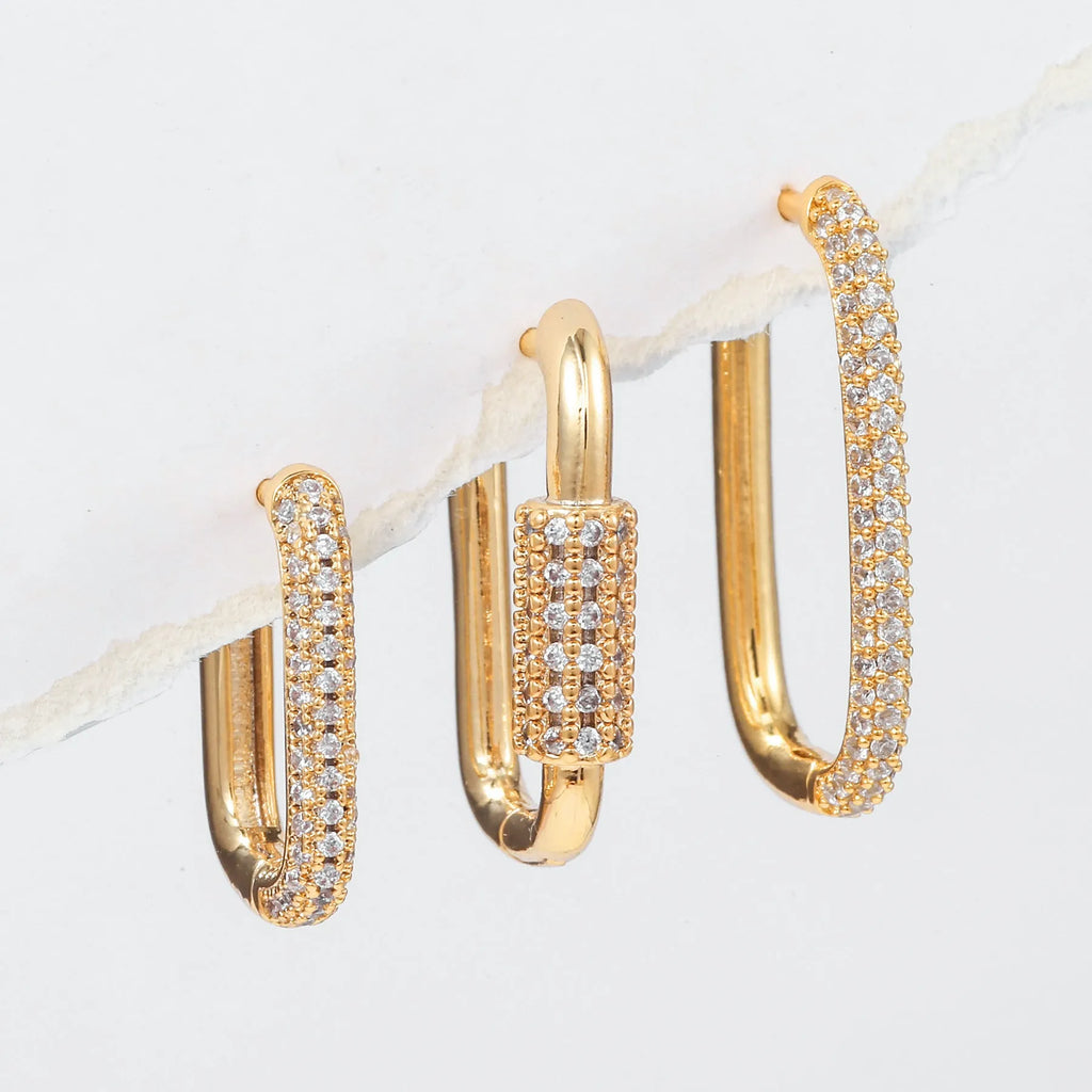 Three geometric ear clips with micro inlaid zircon in gold and white metal colours