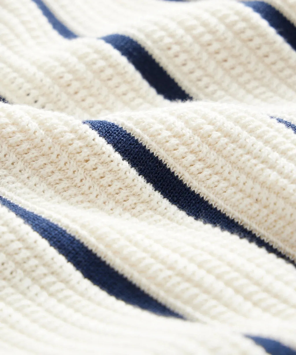 Men's white short sleeve knitted top with asymmetrical lapel design