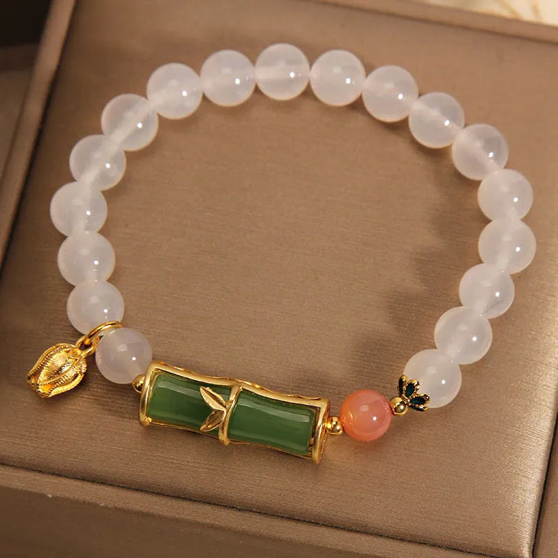 Women's white agate jade bracelet with bamboo joint beads in a retro Chinese style.