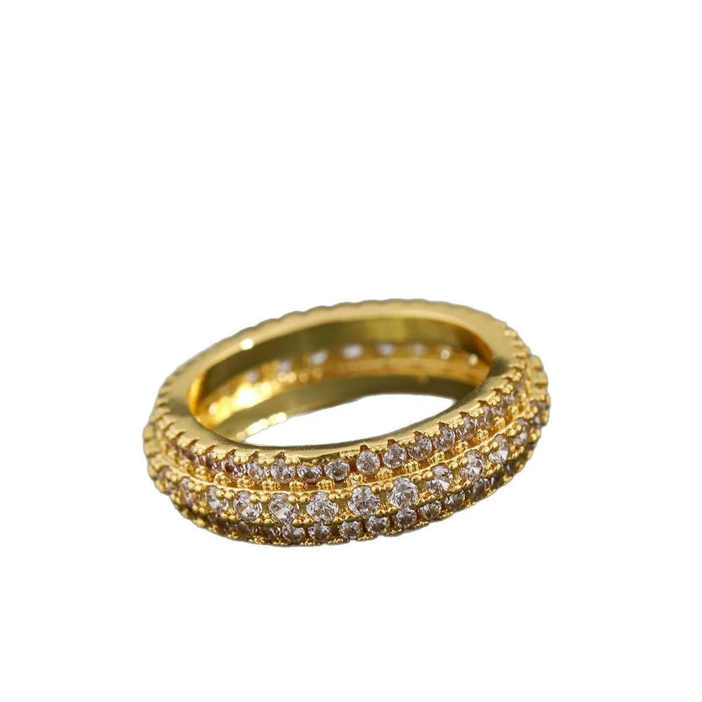 Geometric copper ring with a triangular zircon stone inlay, shown in a choice of colour finishes.