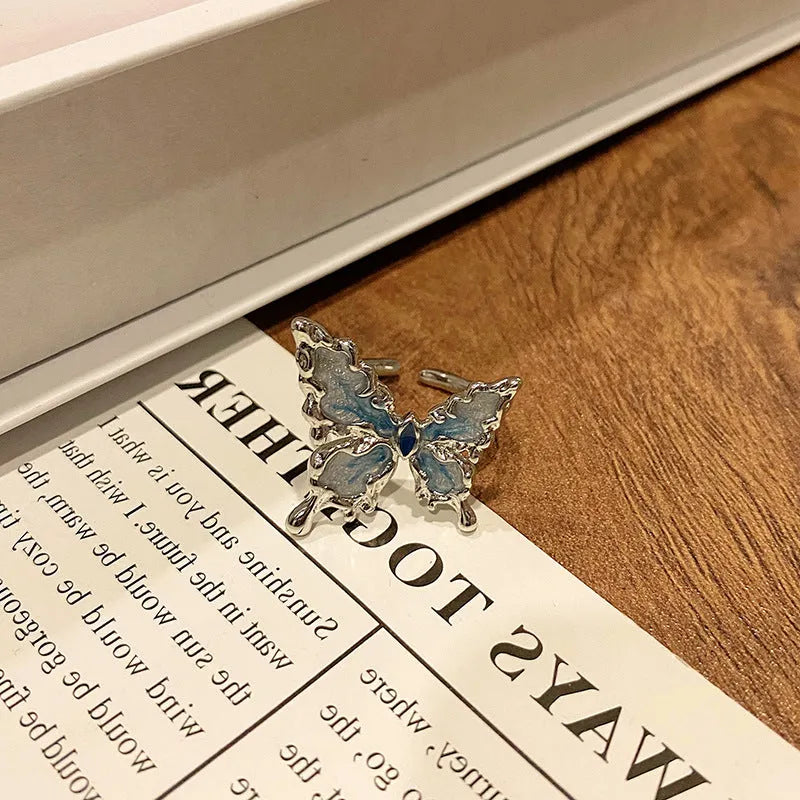 Butterfly women's copper ring with adjustable split ring design showing oil-drip colour treatment