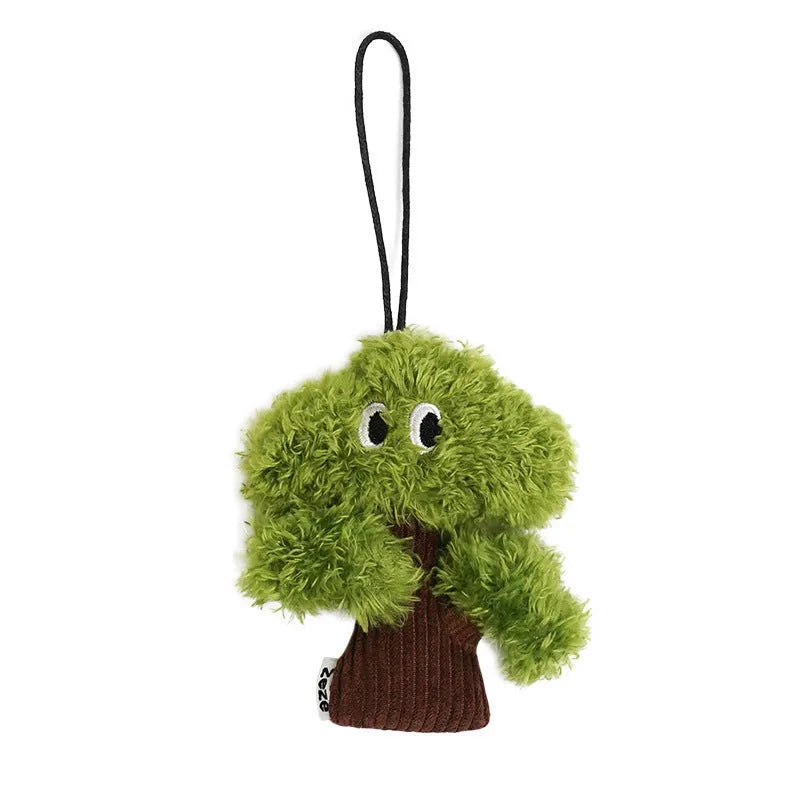 Pine tree-shaped hanging cat chew toy with mint filling, shown next to a ruler for scale