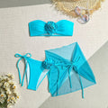 Women's pink tube top swimsuit with three-dimensional flower tied design, matching high-waist shorts and skirt