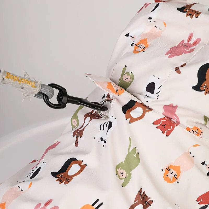 Beige cartoon print dog raincoat with double waterproof PU coating shown on a model dog.