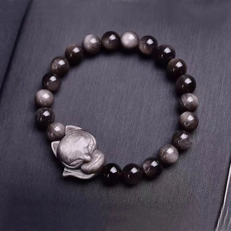 Obsidian fox charm bracelet with 8mm bead and adjustable sliding clasp.