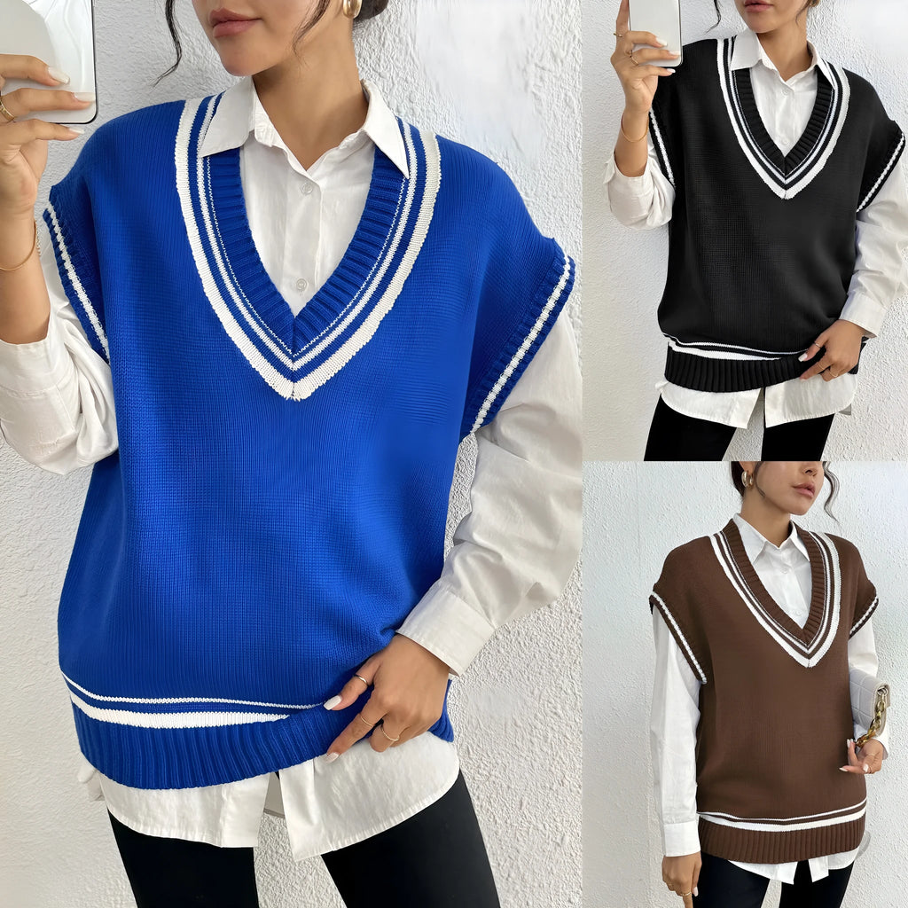 Women's loose fit college style wool vest sweater in blue, laid flat.