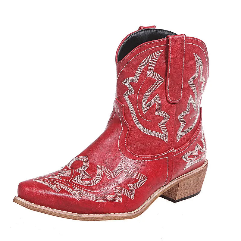 Women's blue embroidered cowboy boots with low chunky heel and pointed toe.