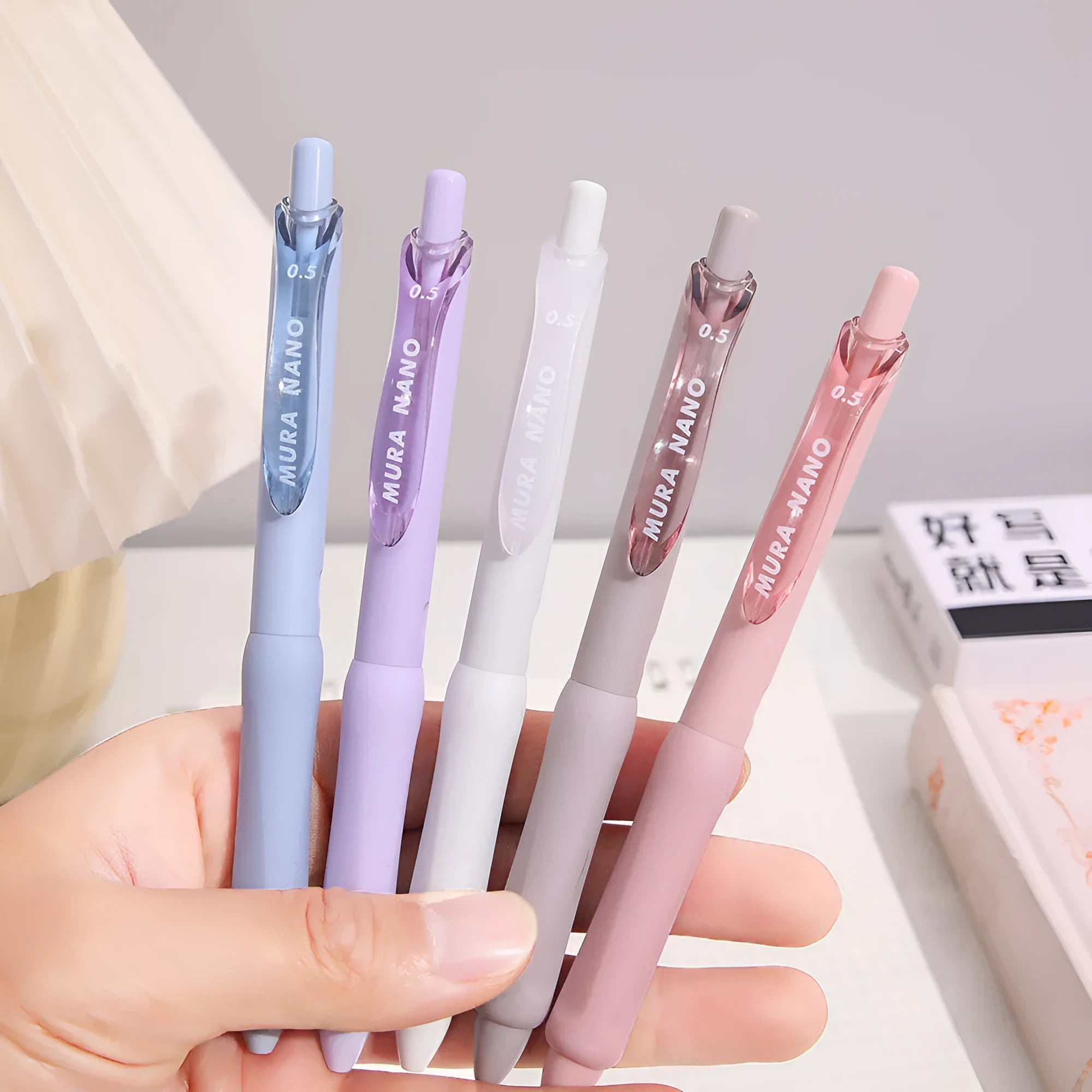 Macaron colour press gel pen with 0.5mm tip showing smoked brown, powder, and white ink options