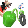 Green and red plastic apple-shaped dog toy with hollow centre for food dispensing