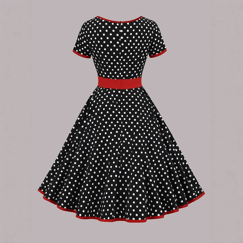 Polka dot dress with square collar, short sleeves, front zipper, and pleated mid-length skirt in multicolour pattern