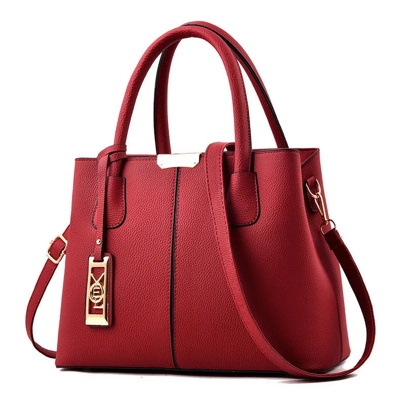 Soft large capacity PU leather shoulder bag in a horizontal square shape with a leather strap.