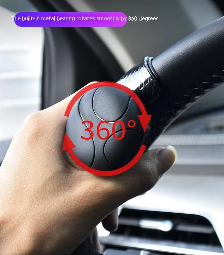 Steering wheel assist ball with metal bearing and silicone grip for single-handed vehicle control