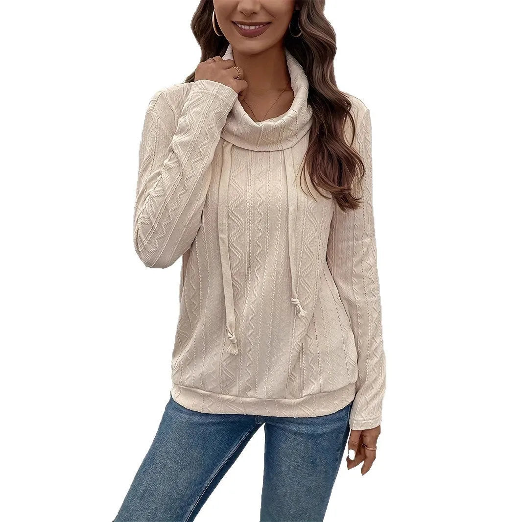 Apricot coloured long sleeve hooded pullover sweater with a drawstring hood on a hanger.