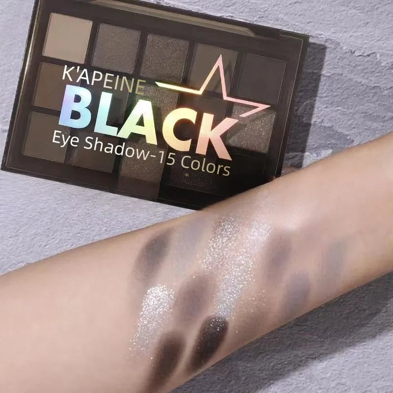 15-colour cartoon style eyeshadow palette showing brown, blue, and dark smoky matte and shimmer shades.