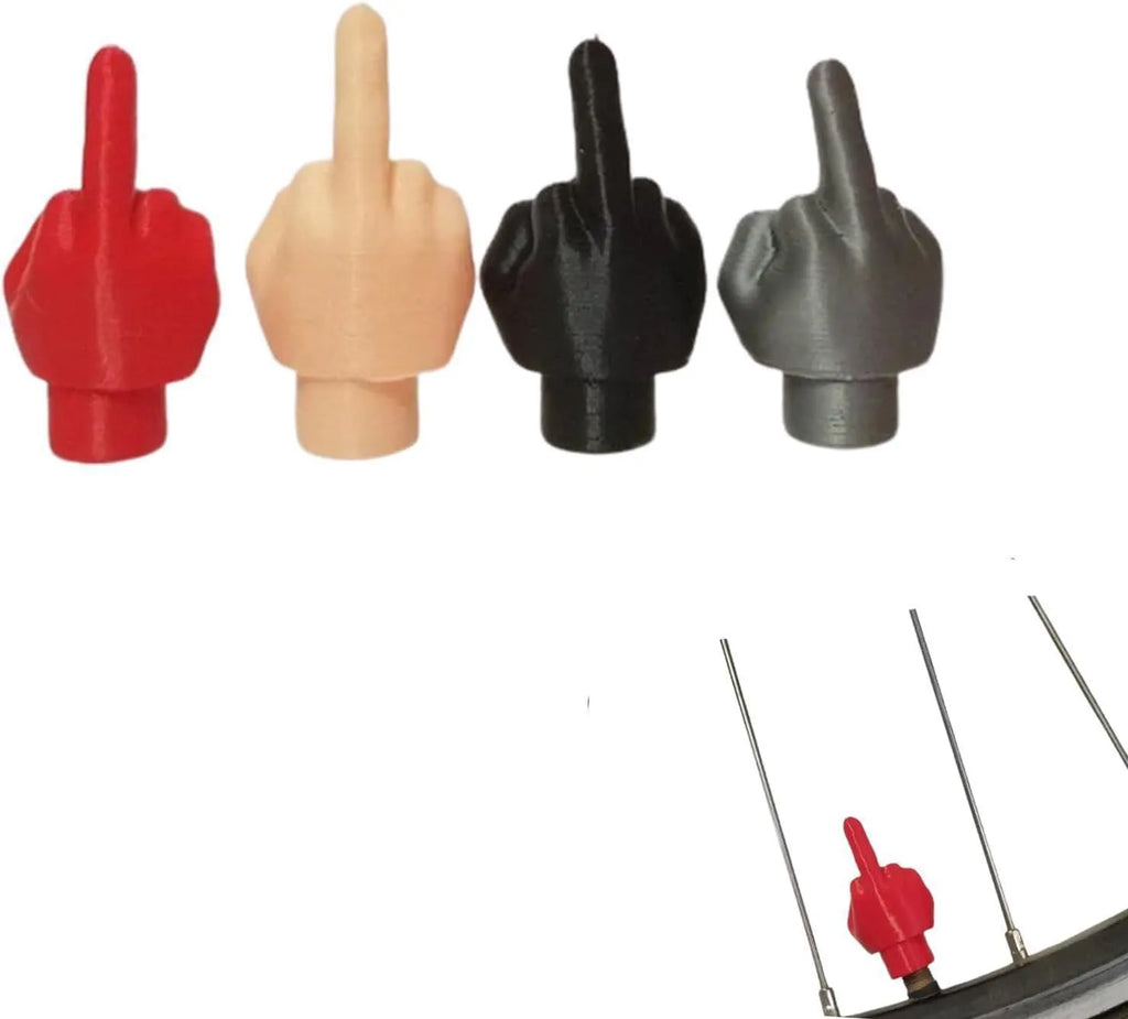 Eight car tyre valve caps, four black and four skin colour, made from latex.
