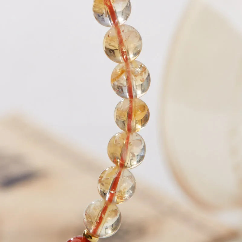 Hand-woven citrine crystal bracelet with five-sutra geometric design in fresh styling