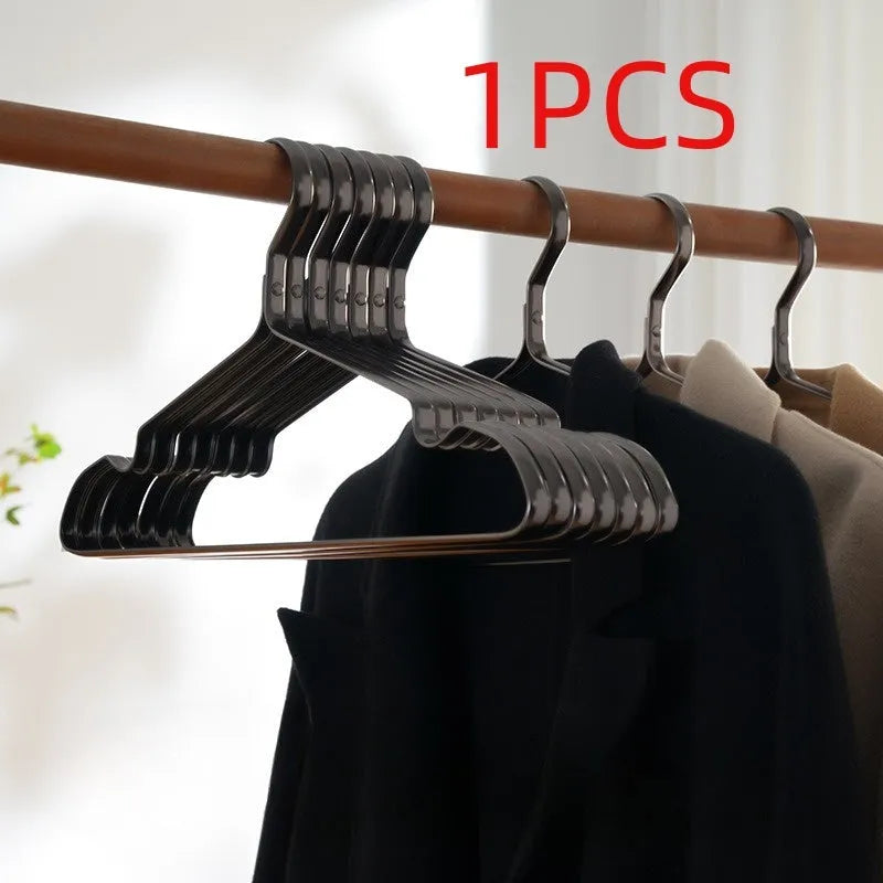 Elegant black modern simplicity clothes hanger with anti-slip surface.