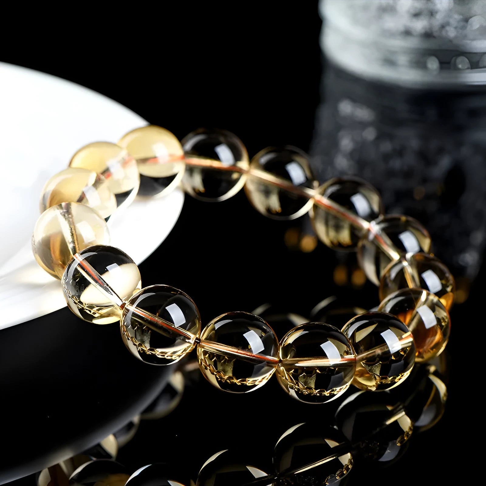 Natural citrine scattered beads ball bracelet showing 7A and 6A colour grade options on a wrist.