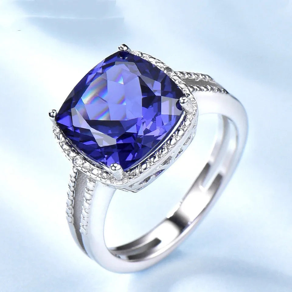 Women's sterling silver ring with a blue Tanzanite gemstone, shown in size 10.
