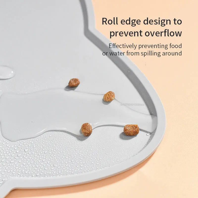 Blue silicone waterproof pet feeding mat for dog or cat food bowls on a wooden floor.