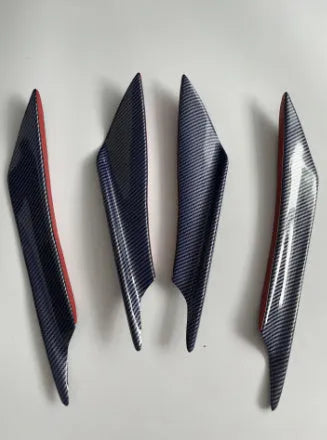 Set of four carbon fibre pattern automotive bumper blades mounted on vehicle