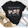 Black cotton t-shirt with round neck and short sleeves on hanger
