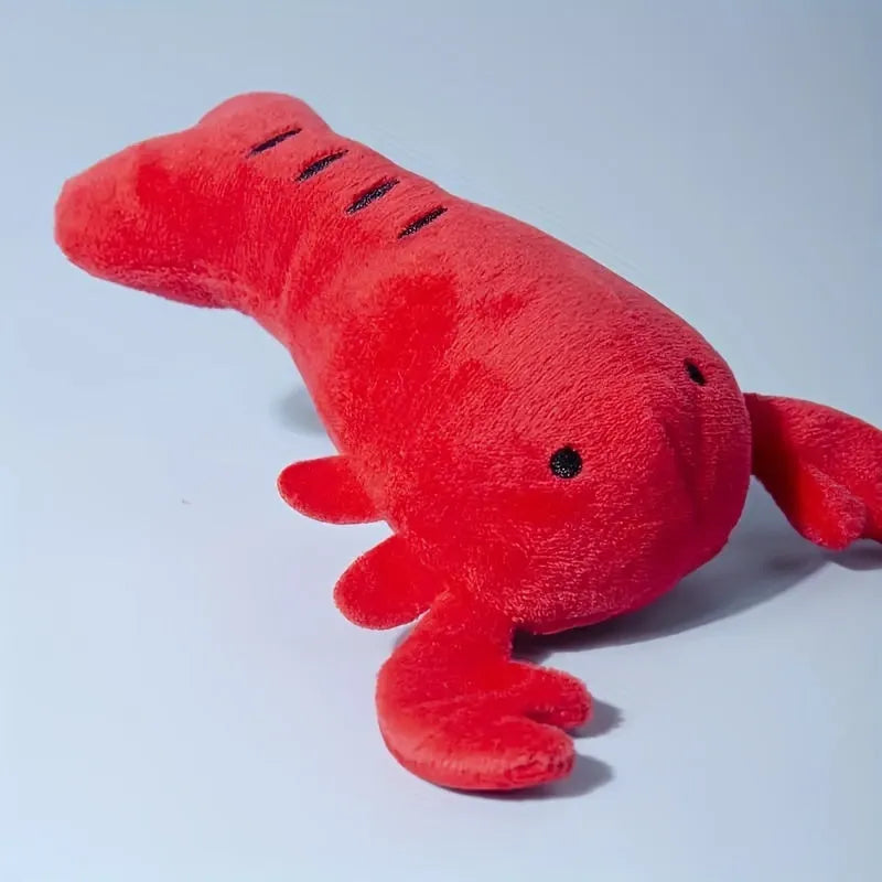 Red lobster shaped squeaky dog toy with soft plush material measuring 12.5cm length