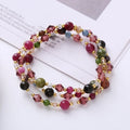 Close-up of a women's adjustable three-ring crystal bracelet in a choice of colours on a wrist.