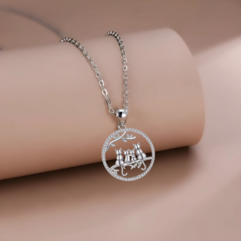 Copper Four Kitten Necklace with cat charm pendant on a cross chain for women.