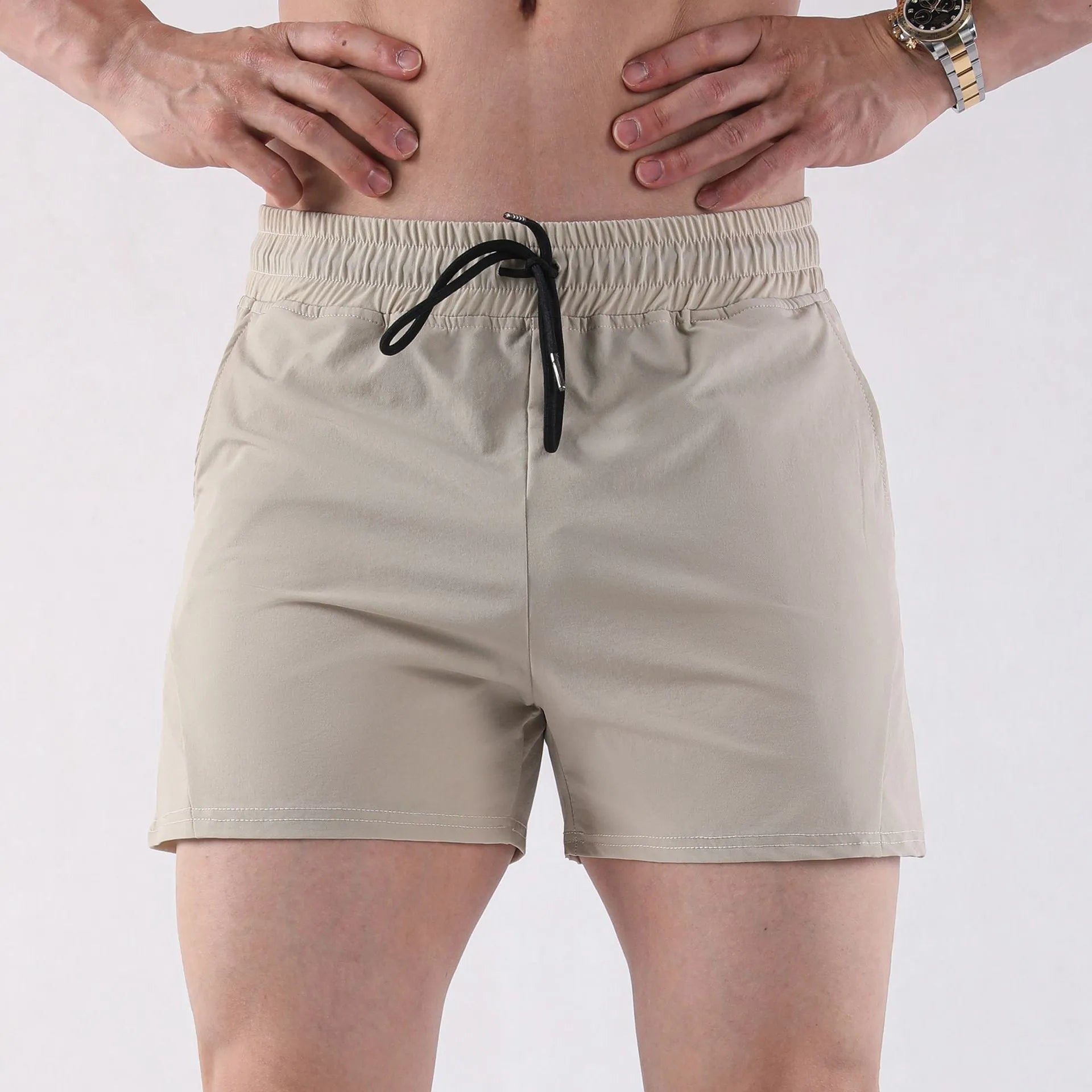 Men's grey polyester basketball shorts with elastic waistband on a white background.