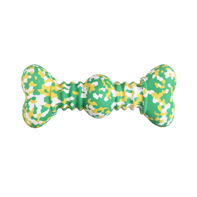 Green and white camouflage patterned natural rubber bone-shaped dog chew toy for large dogs on a wooden floor.