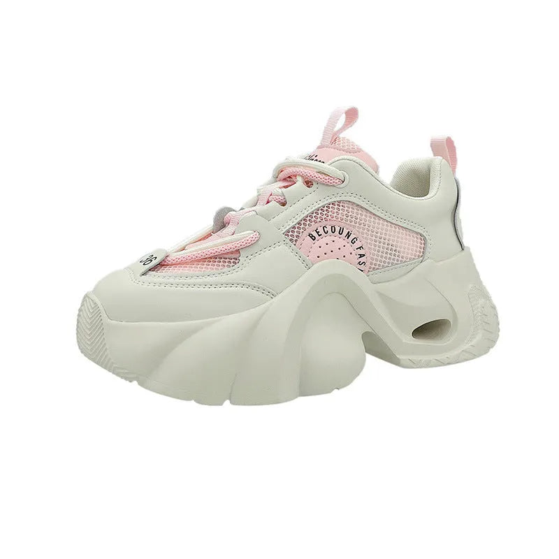 Women's pink thick sole sneakers with cross straps and breathable mesh lining on a white background.