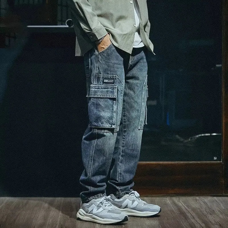 Blue men's loose straight-leg retro jeans with a zip fly, laid flat.
