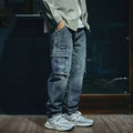 Blue men's loose straight-leg retro jeans with a zip fly, laid flat.