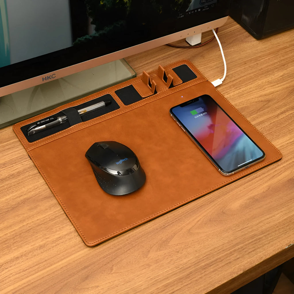 Pink wireless charging mouse pad with phone holder on a desk, showing 320mm by 260mm size and USB cable.