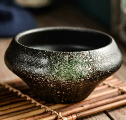 Tall porcelain Japanese soup bowl with stone conch shape and underglaze retro pattern.