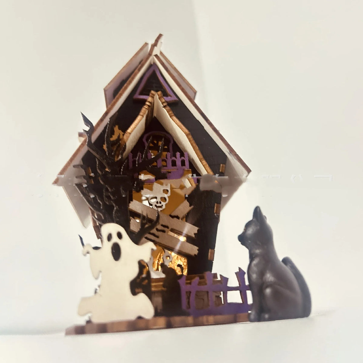 Wooden DIY haunted house Halloween decoration with luminous design measuring 14x10.5x19cm
