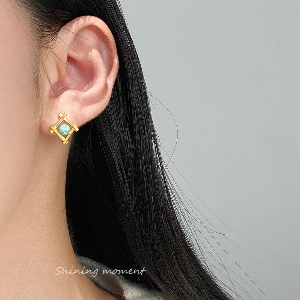 Geometric cross quadrangle stud earrings in 925 silver with silver or gold finish options