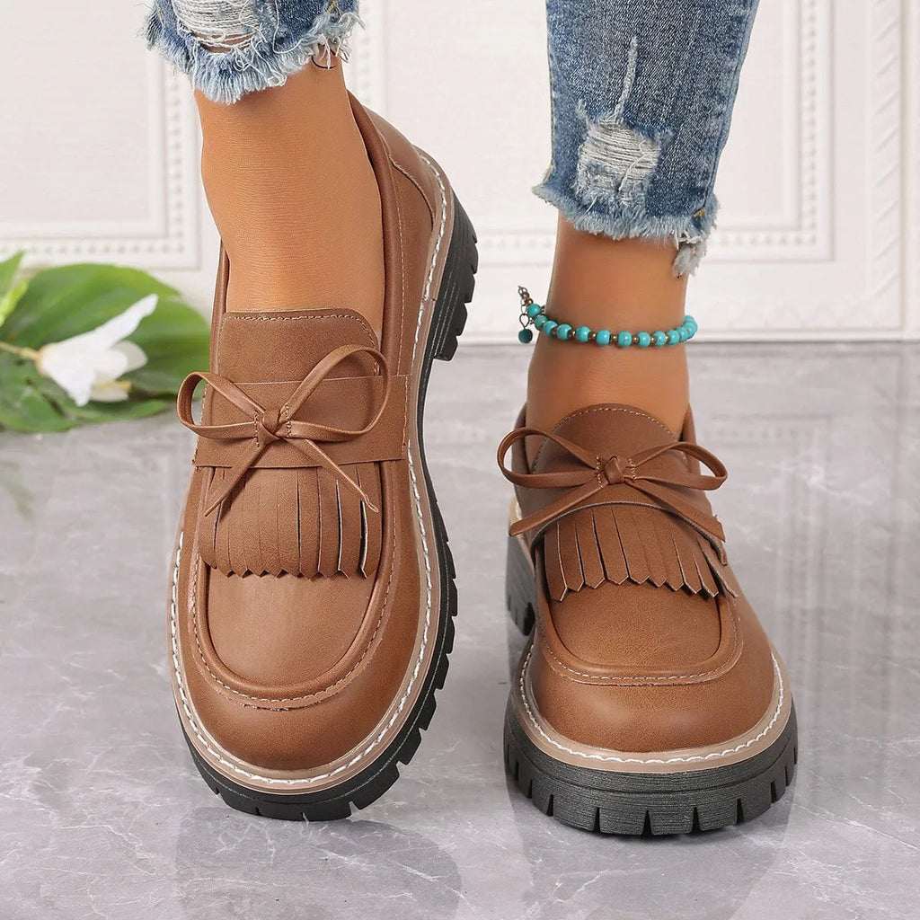 Women's black plus size loafers with tassel decoration, chunky heel, and round toe design